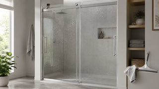 Water beading on a clean glass shower door beside a squeegee and microfiber cloth in a modern bathroom.